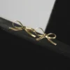 Ribbon Knot Bow Gold Earrings Front Image