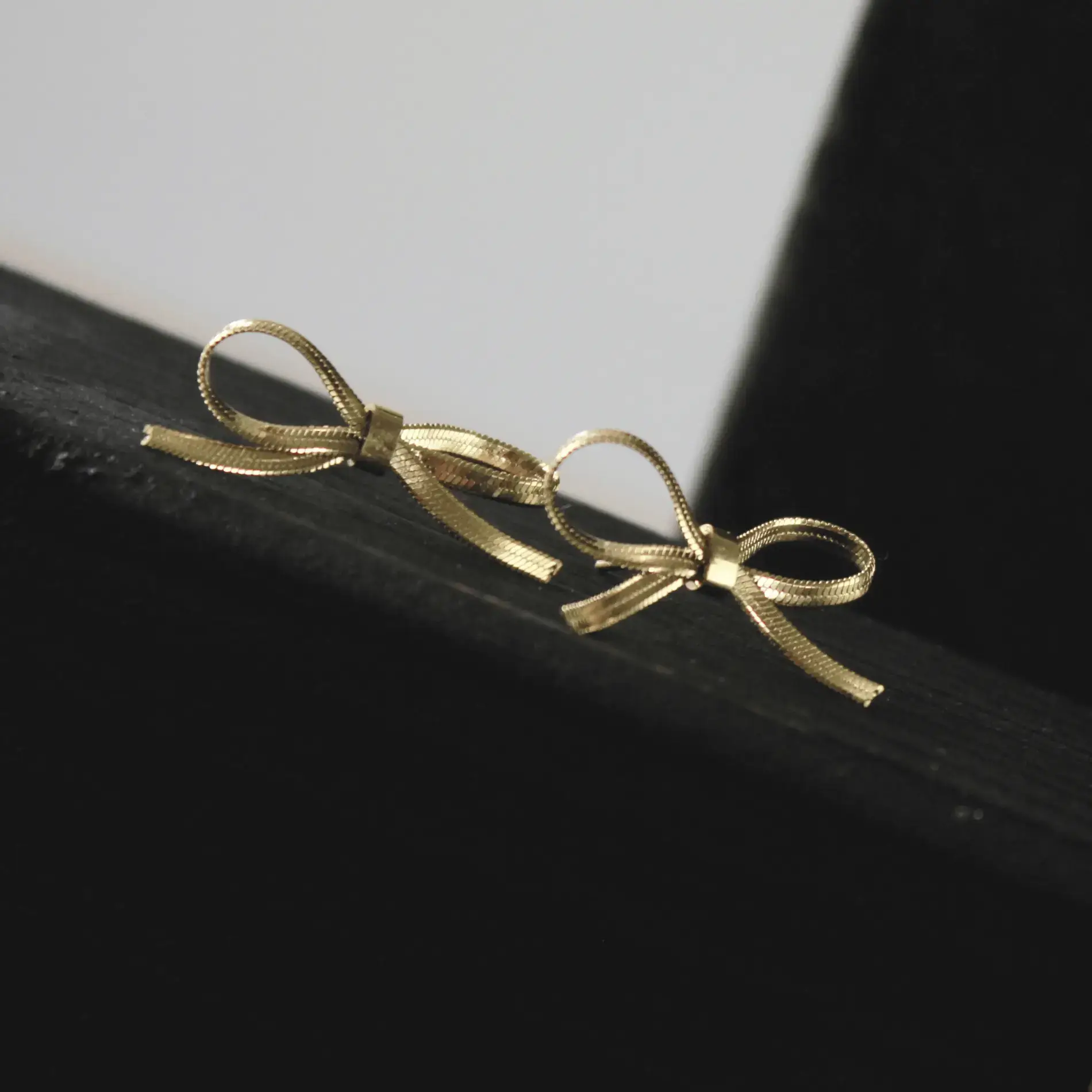 Ribbon Knot Bow Gold Earrings Front Image