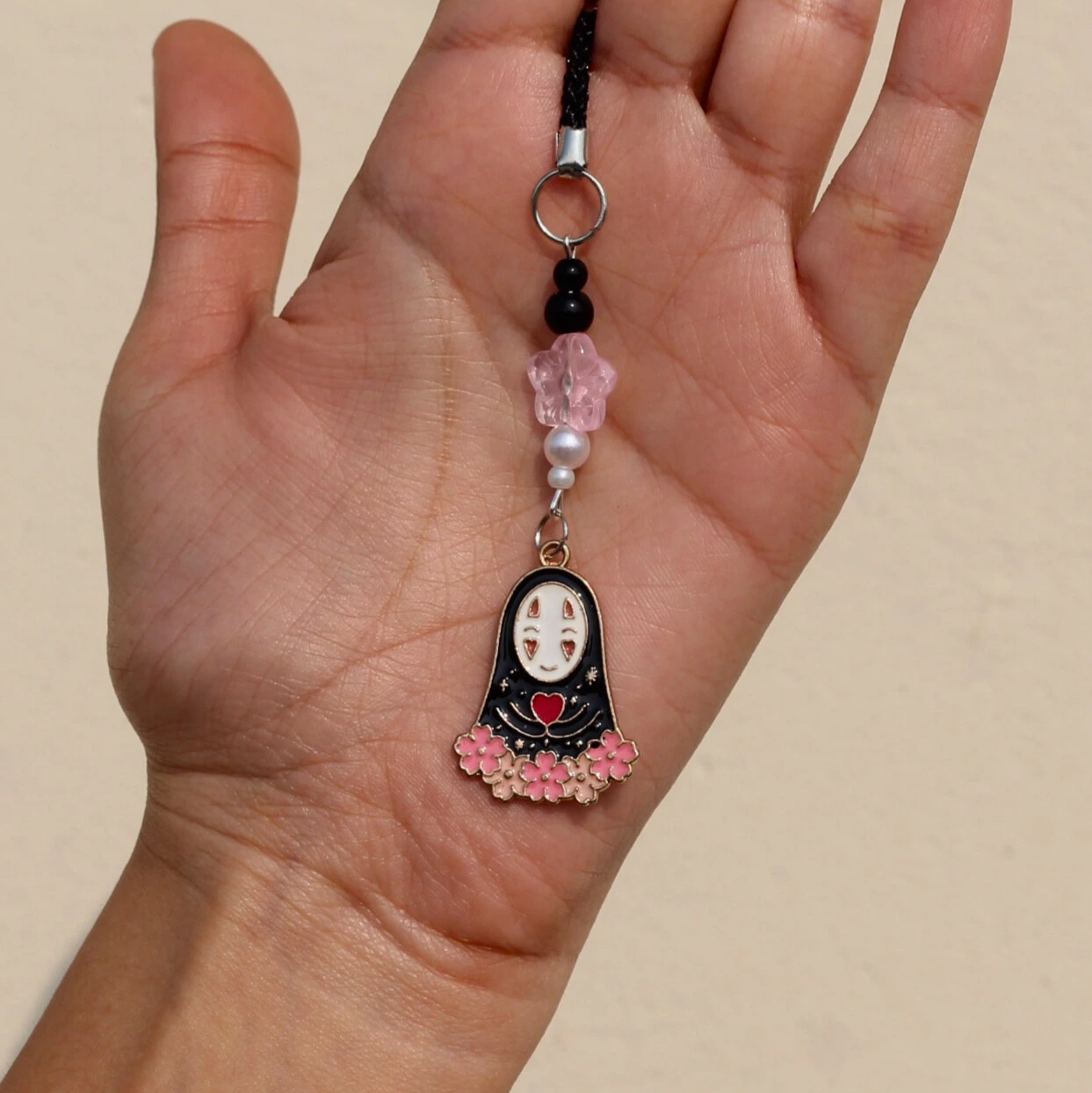 No Face Sakura Phone Charm in hand Overview Image