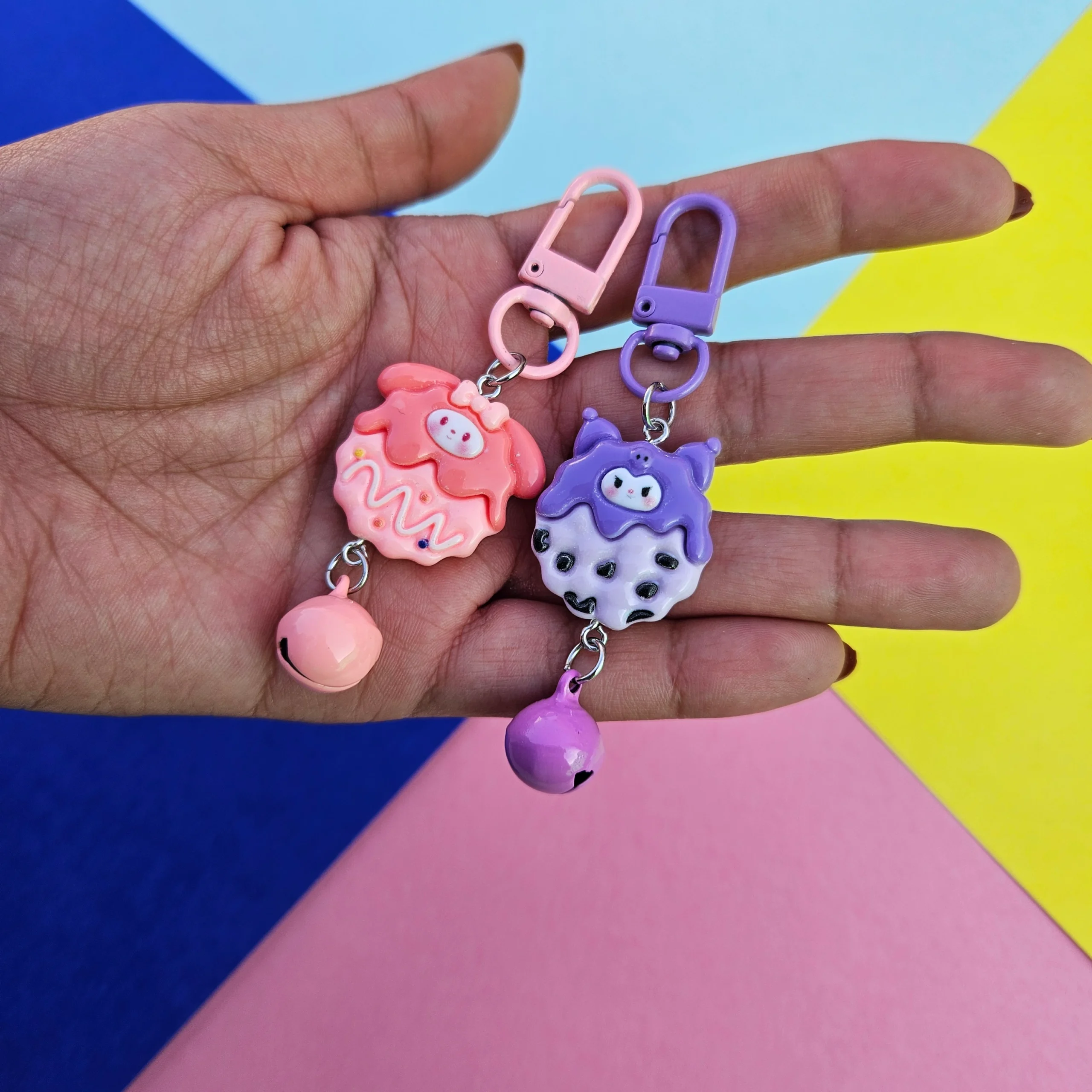 Sanrio Cookie Themed Charm Keychains in Hand Overview Image